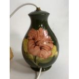 A Moorcroft Hibiscus pottery lamp.H:20cm