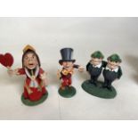 A collection of three Goebel of Alice in Wonderland resin figurines including The Mad Hatter, The