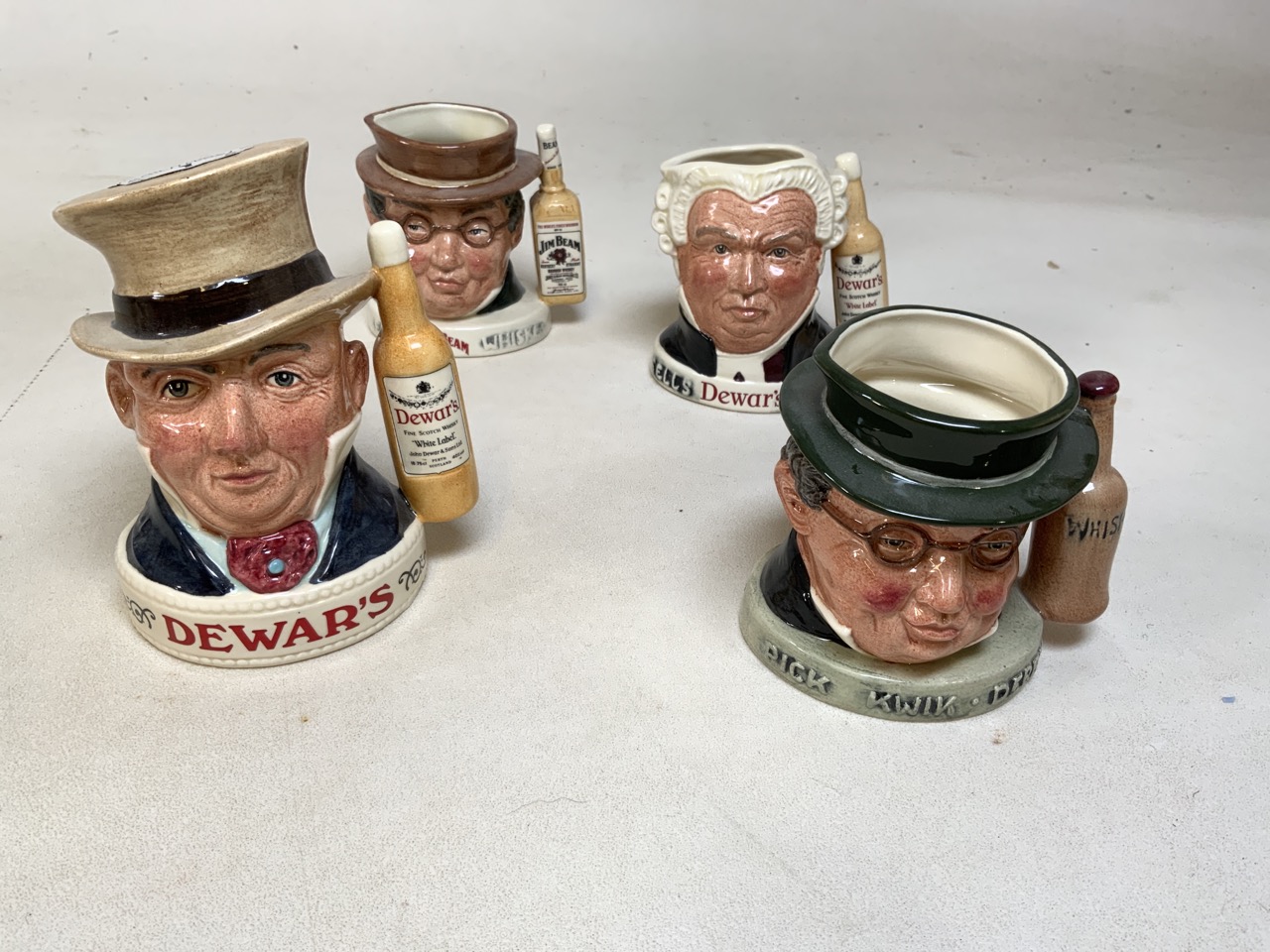 A collection of Royal Doulton character jugs. Tallest height 15cm