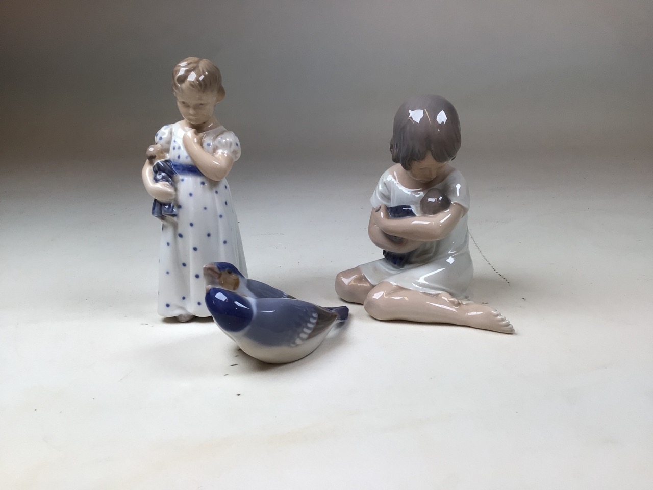 Three Royal Copenhagen porcelain items to include Girl with Doll 3539. Girl with Baby 1938 and