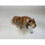 A vintage Royal Dux Tiger with original labels