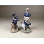 Two Royal Copenhagen figural groups to include The Whittler, No. 905 and Girl with Goose No 527.