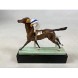 A Royal Worcester Lindner Horse Cantering to the Post modelled by Doris Lindner 3117. W:20cm x H: