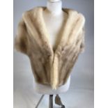 A vintage mink fur stole with inner embellished pockets embroidered with initials CMB