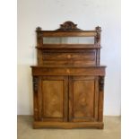 An inlaid walnut credenza with large double cupboard doors with interior shelf. With original mirror