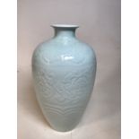 A Chinese porcelain pale green celadon relief moulded vaseW:22cm x H:41cm