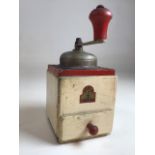 An Armin Trosser wooden coffee grinder. W:10cm x D:12cm x H:22cm