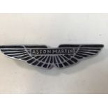 An aluminium Aston Martin sign W:33cm x H:8cm