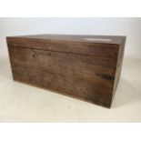 A large teak travelling trunk with original labels. W:82cm x D:52cm x H:38cm