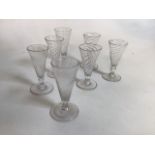A set of four Georgian jelly glasses together with three others. Tallest glass 13cm