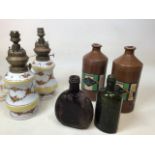 A pair of ceramic oil lamps converted to electric, two stoneware Radium ink bottles and other