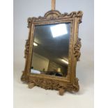 A gilt framed pier mirror with decorative moulding. W:59cm x H:78cm