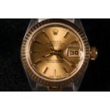 ROLEX. A ladies stainless steel and 18ct yellow gold Oyster Perpetual date just wristwatch. Diameter