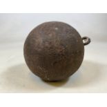 An large antique cast iron ball with loop, no chain.