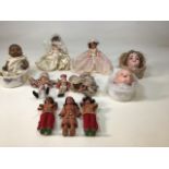 A collection of dolls including an Armand Marseille doll head and complete doll and a DLP doll head.