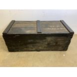 A black painted wooden trunk with hand painted lettering NR COOK LT RN. W:102cm x D:48cm x H:41cm