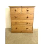 A modern pine chest of drawers. W:93cm x D:41cm x H:104cm