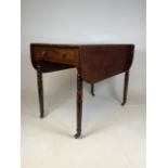 A Mahogany Pembroke table. Brass castors and inlaid detail. W:56cm x H:71cm