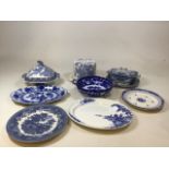 A collection of vintage blue and white china includes a lidded tureen with two plates, two Adams