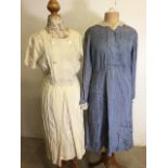 A vintage blue maids dress with embellished collar and cuffs together with a 1930s button yoke dress