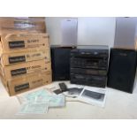 A Technics stacking stereo system with speakers. To include RS X911, ST X933L,SL J110R, SU X911