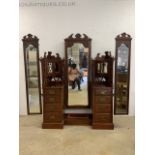 A art nouveau dressing chest with central chevalier mirror flanked by two mirrored cupboards above