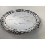 A silver footed tray with engraved signatures to top. Hallmark to base Mappin and Webb, weight 569gm
