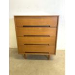 A Stag mid century chest of four drawers oink light teak.