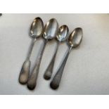 Four silver spoons 64 grams.