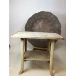 A cast iron painted table with shelf together with a large metal charger W:60cm x H:50cm Table W:
