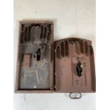 Two vintage metal glove moulds.