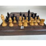 A part chess set and board.