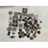 A collection of coins and badges.