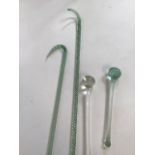 Two Nailsea glass walking sticks together with two Nailsea drumsticks H:130cm longest walking