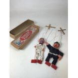 Two boxed Barnsbury puppets - a policeman and a dog. Both boxed - one box without lid