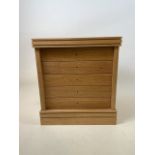 A bespoke made oak watch makers cabinet or collectors cabinet, with five pull out glazed drawers.