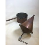 A large vintage copper saucepan together with a copper cone shaped item W:18cm x H:18cm saucepan
