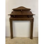 An oak fire surround with carved details. W:122cm x D:20cm x H:170cm