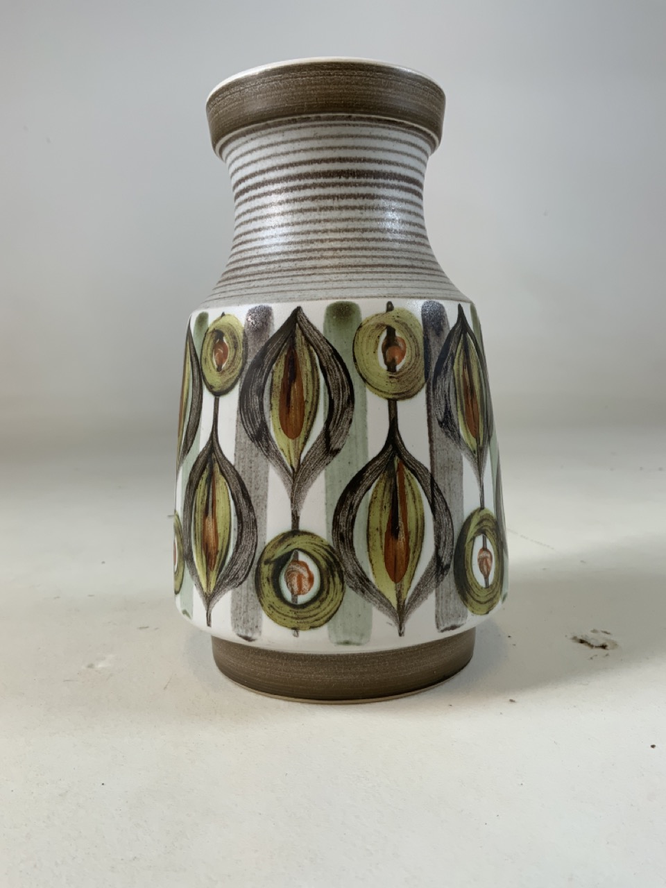 A 1960s Langley pottery peacock vase singed P to base. H:20cm