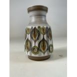 A 1960s Langley pottery peacock vase singed P to base. H:20cm