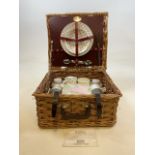 A Vintage wicker picnic basket and contents. The Brexton Collection. W:39cm x D:35cm x H:20cm