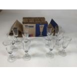 Twenty four Arcoroc Sherry glasses./ flutes. Twelve boxed. Height 14.5cm.