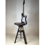 A contemporary guitar chair, swivel and height adjustable.
