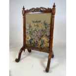 A Victorian walnut fire screen with hand needle point. Damage to base see pictures. W:52cm x D: