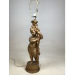 A gilt Putto lamp. Height to top of base 59cm