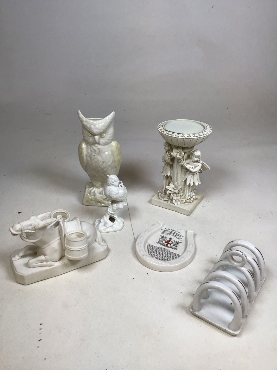 WH Kerr and co Parian ware seated donkey together with a Belleek owl and other items H:21cm Height