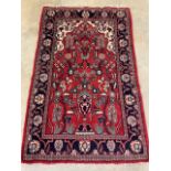 A Iranian small persian rug. W:197cm x D:123cm