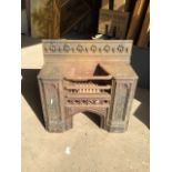 A decorative cast iron fire insert by Carron marked on front W:62cm x D:22cm x H:61cm