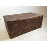 A pine box with tongue and groove lid W:64cm x D:37cm x H:26cm