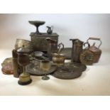 A large collection of brass and copper items including, pitchers, plaques, a kettle, coal box and